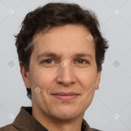 Joyful white adult male with short  brown hair and grey eyes