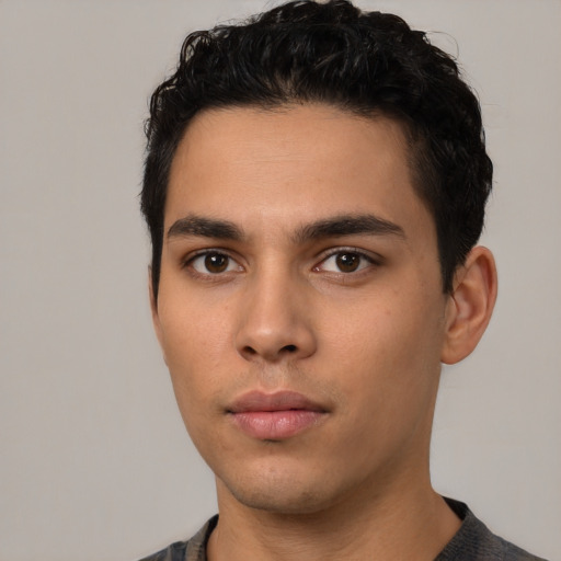 Neutral latino young-adult male with short  black hair and brown eyes