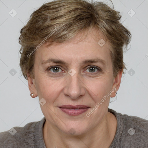 Joyful white adult female with medium  brown hair and grey eyes