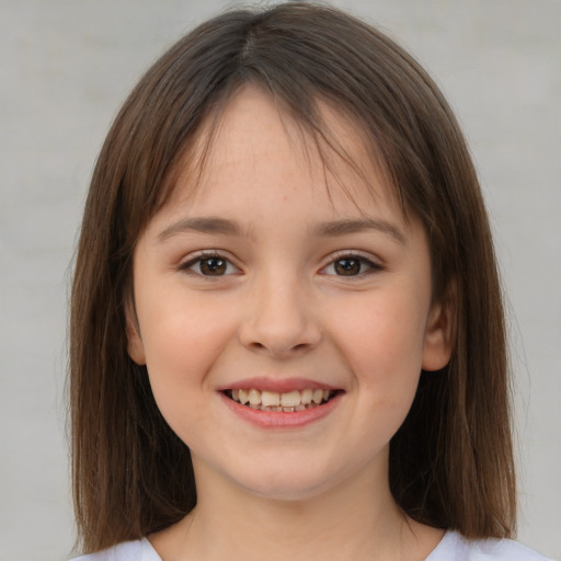 Joyful white child female with medium  brown hair and brown eyes