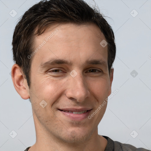 Joyful white adult male with short  brown hair and brown eyes