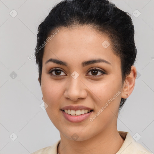 Joyful latino young-adult female with short  brown hair and brown eyes