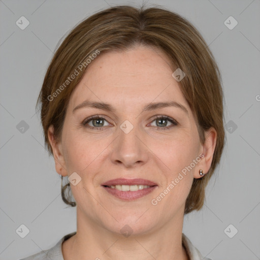 Joyful white adult female with medium  brown hair and grey eyes