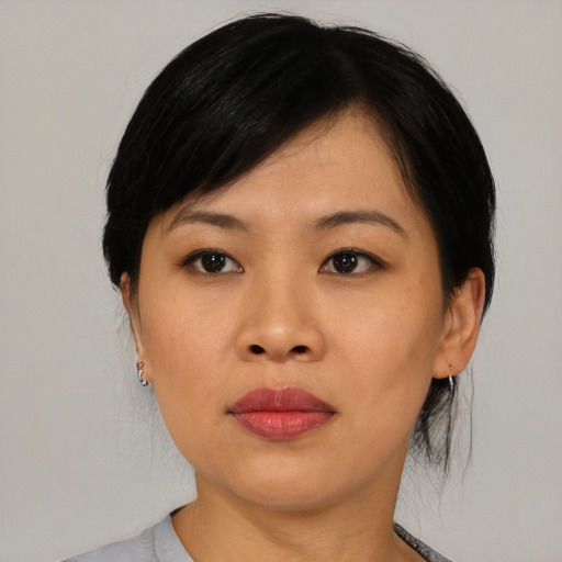 Neutral asian young-adult female with medium  black hair and brown eyes