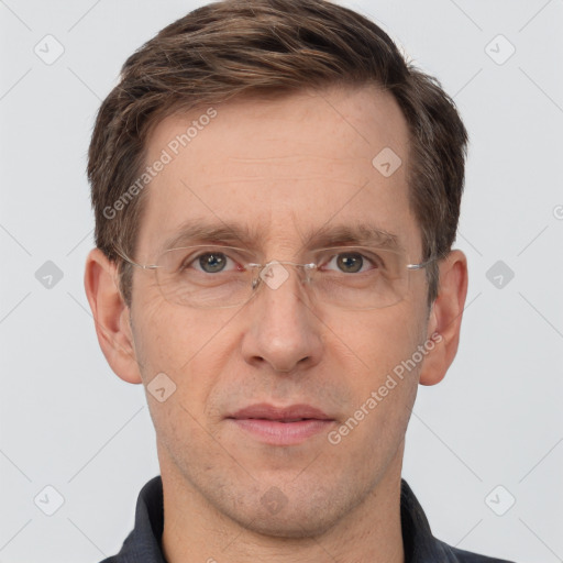 Joyful white adult male with short  brown hair and grey eyes