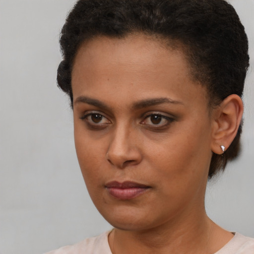 Neutral latino young-adult female with short  brown hair and brown eyes