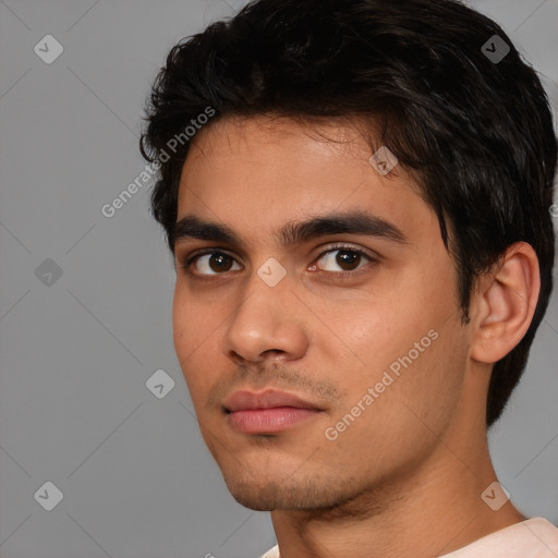 Neutral white young-adult male with short  black hair and brown eyes