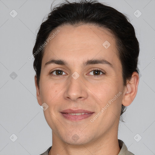 Joyful white adult male with short  brown hair and brown eyes