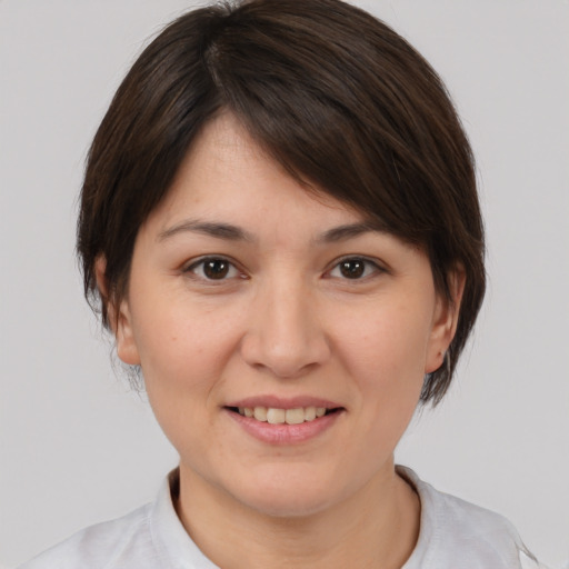 Joyful white young-adult female with medium  brown hair and brown eyes