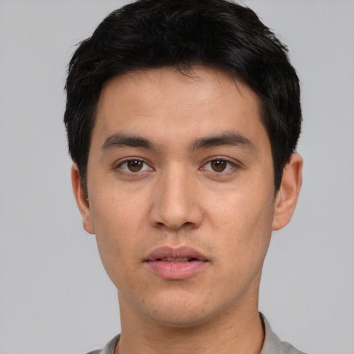 Neutral white young-adult male with short  black hair and brown eyes