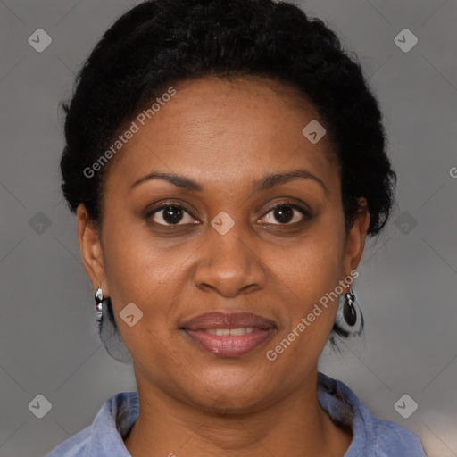 Joyful black adult female with short  brown hair and brown eyes