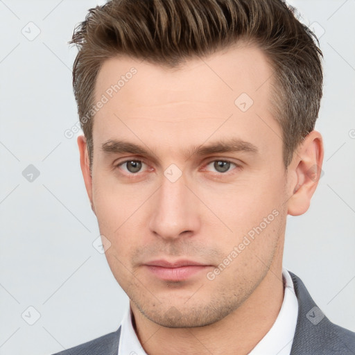 Neutral white young-adult male with short  brown hair and grey eyes