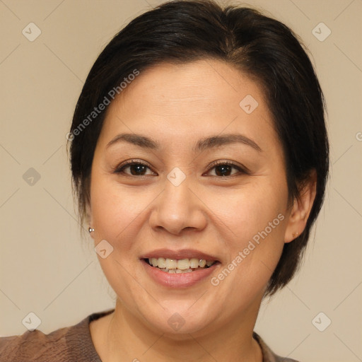 Joyful white adult female with medium  brown hair and brown eyes