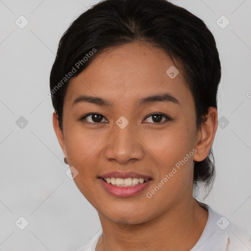 Joyful asian young-adult female with short  black hair and brown eyes