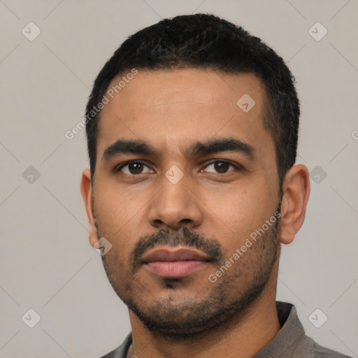Neutral latino young-adult male with short  black hair and brown eyes