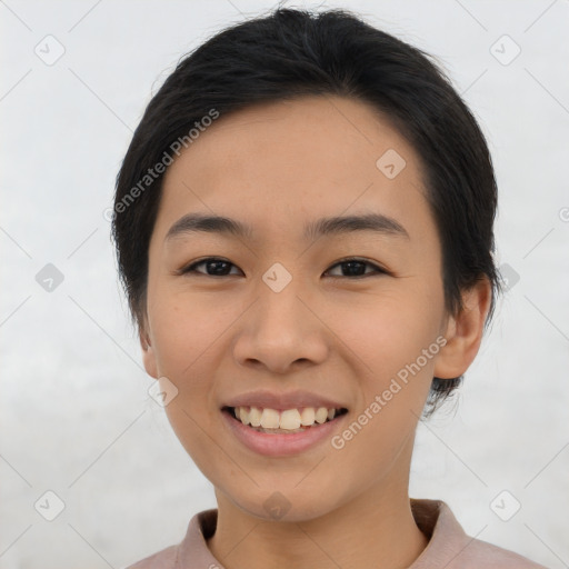 Joyful asian young-adult female with short  brown hair and brown eyes