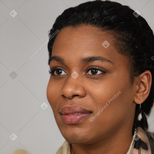 Joyful black young-adult female with short  black hair and brown eyes