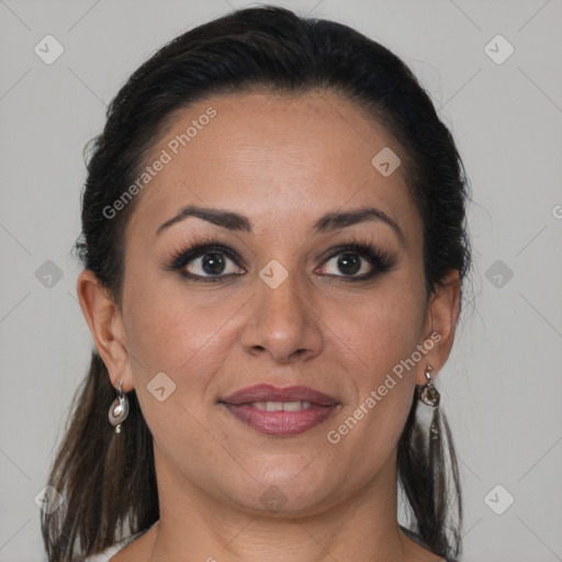 Joyful latino adult female with medium  brown hair and brown eyes