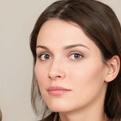 Neutral white young-adult female with medium  brown hair and brown eyes