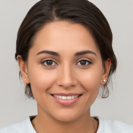 Joyful white young-adult female with medium  brown hair and brown eyes