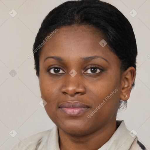 Joyful black young-adult female with medium  black hair and brown eyes