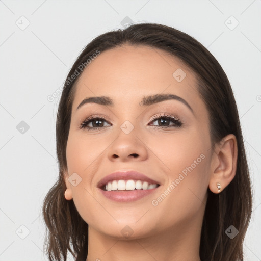 Joyful white young-adult female with long  brown hair and brown eyes