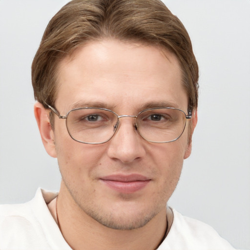 Joyful white adult male with short  brown hair and grey eyes