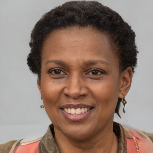 Joyful latino adult female with short  brown hair and brown eyes