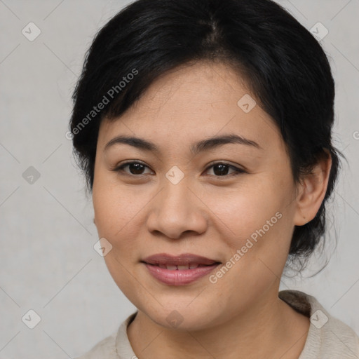 Joyful asian young-adult female with medium  brown hair and brown eyes