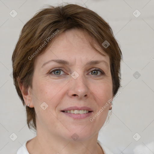 Joyful white adult female with short  brown hair and grey eyes