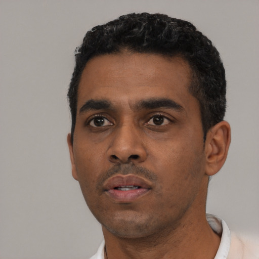 Neutral black young-adult male with short  black hair and brown eyes