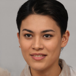 Joyful asian young-adult female with short  brown hair and brown eyes