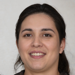 Joyful white young-adult female with medium  brown hair and brown eyes