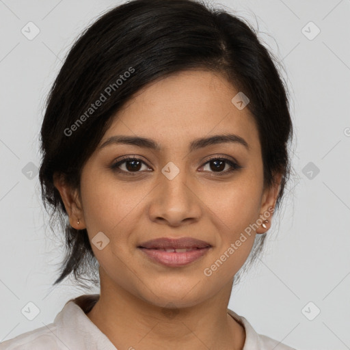 Joyful latino young-adult female with medium  brown hair and brown eyes