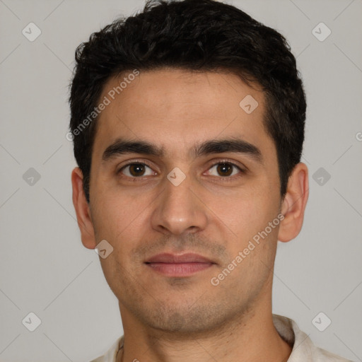 Joyful white young-adult male with short  black hair and brown eyes