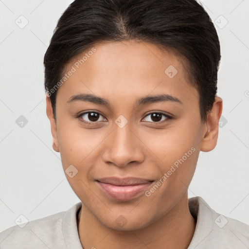 Joyful latino young-adult female with short  brown hair and brown eyes