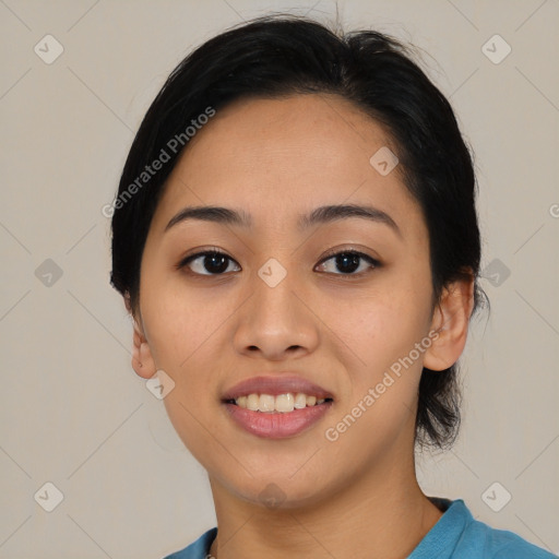 Joyful asian young-adult female with medium  black hair and brown eyes