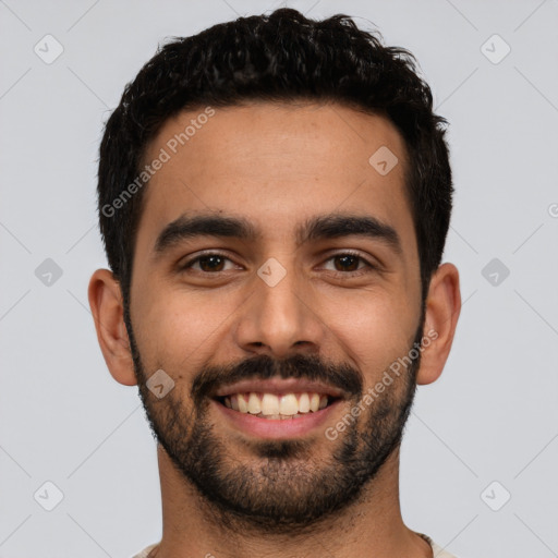 Joyful latino young-adult male with short  black hair and brown eyes