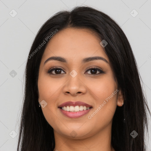 Joyful latino young-adult female with long  brown hair and brown eyes