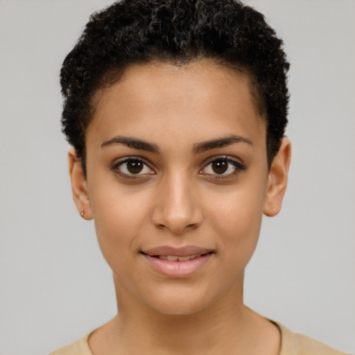 Joyful latino young-adult female with short  brown hair and brown eyes