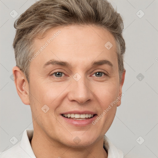 Joyful white adult male with short  brown hair and grey eyes