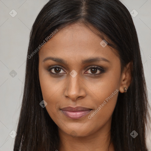 Joyful black young-adult female with long  brown hair and brown eyes