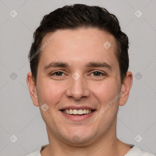 Joyful white young-adult male with short  brown hair and brown eyes