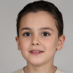 Joyful white child female with short  brown hair and brown eyes