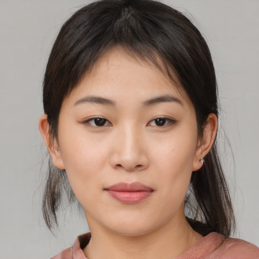 Neutral asian young-adult female with medium  brown hair and brown eyes