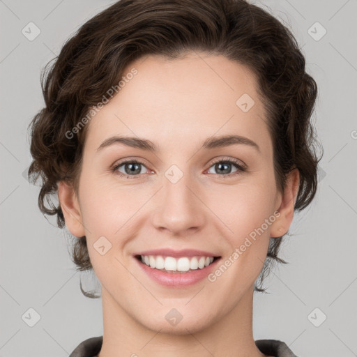 Joyful white young-adult female with medium  brown hair and green eyes