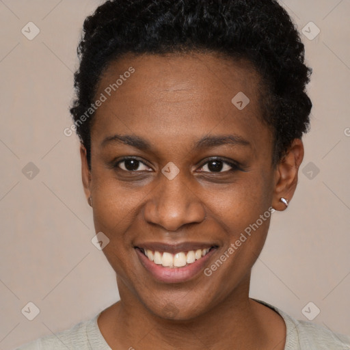 Joyful black young-adult female with short  brown hair and brown eyes