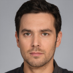 Neutral white young-adult male with short  black hair and brown eyes