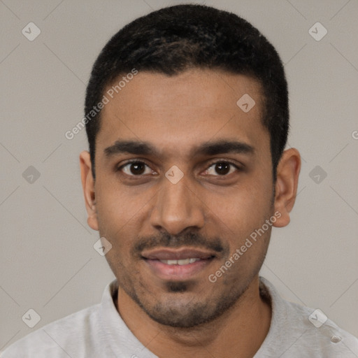 Joyful black young-adult male with short  black hair and brown eyes