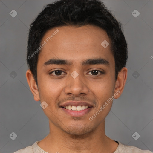 Joyful latino young-adult male with short  brown hair and brown eyes